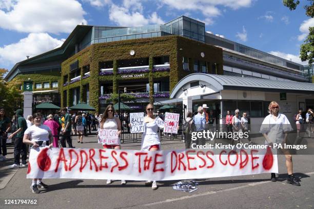 Campaigners from Address The Dress Code outside the main gate at Wimbledon protest over its all white dress code while women are on their period, on...