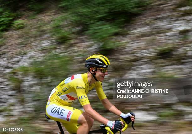 Team Emirates team's Slovenian rider Tadej Pogacar wearing the overall leader's yellow jersey cycles during the 8th stage of the 109th edition of the...