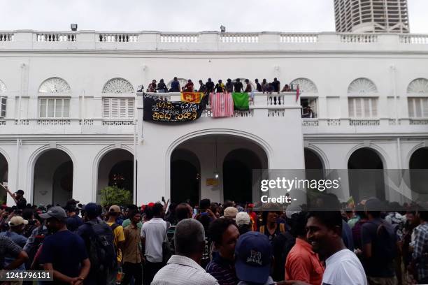 Protestors demanding the resignation of Sri Lanka's President Gotabaya Rajapaksa gather inside the compound of Sri Lanka's Presidential Palace in...