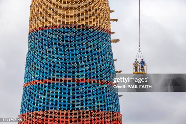 The Craigyhill bonfire is constructed on the Craigyhill estate in Larne, Northern Ireland on July 9, 2022 ahead of the traditional 11th night...