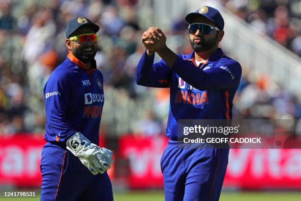 India's Rishabh Pant smiles as India's Rohit Sharma holds onto a catch to dismiss England's Jason Roy off the first ball of the England Innings...