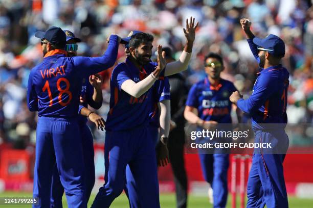 India's Jasprit Bumrah celebrates with teammates after bowling England's Liam Livingstone during the '2nd Vitality IT20' Twenty20 International...