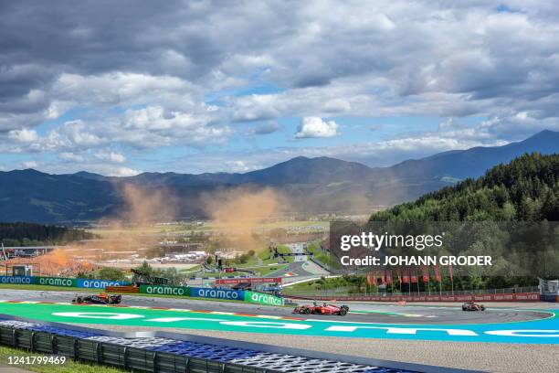 Red Bull Racing's Dutch driver Max Verstappen, Ferrari's Monegasque driver Charles Leclerc and Ferrari's Spanish driver Carlos Sainz Jr compete...