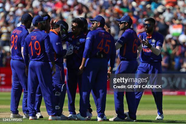 India's players celebrate the wicket of England's Jos Buttler during the '2nd Vitality IT20' Twenty20 International cricket match between England and...