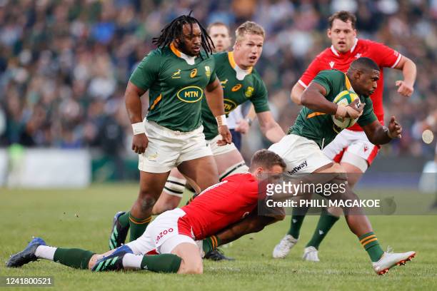 South Africa's fullback Warrick Gelant is tckled during an international rugby union match between South Africa and Wales at the Toyota Stadium in...