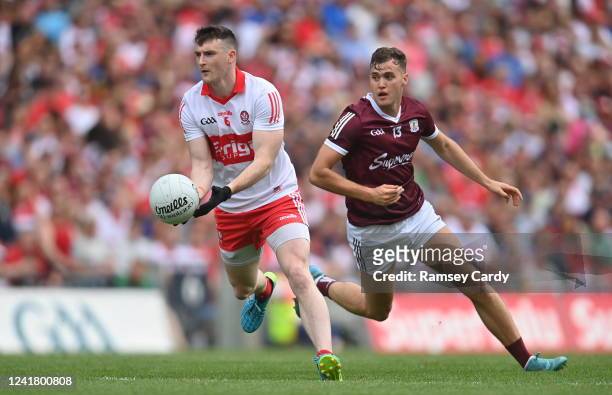 Dublin , Ireland - 9 July 2022; Gareth McKinless of Derry in action against Robert Finnerty of Galway during the GAA Football All-Ireland Senior...