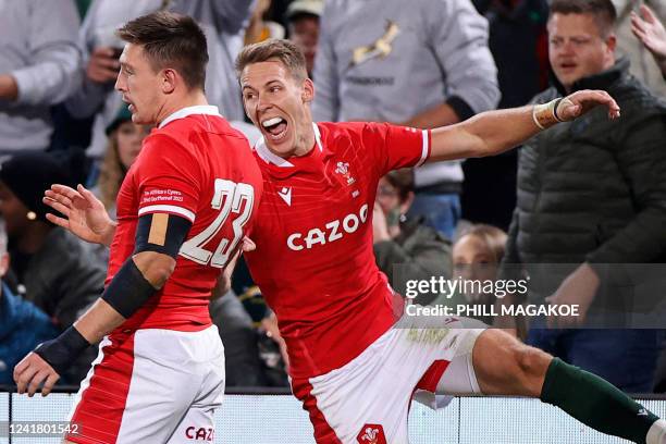 Wales' full-back Liam Williams congratulates Wales' Josh Adams after scoring a try during an international rugby union match between South Africa and...