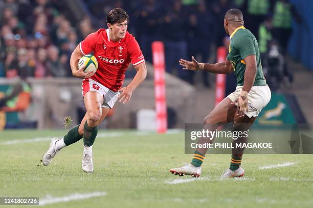 Wales' wing Louis Rees-Zammit runs with the ball during an international rugby union match between South Africa and Wales at the Toyota Stadium in...