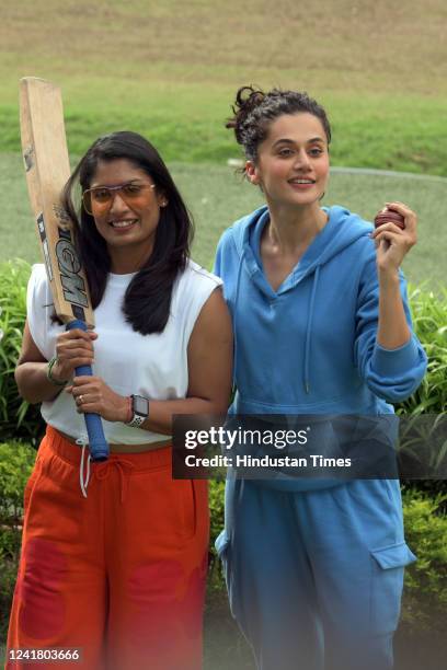 Former Indian women's cricket team captain Mithali Raj and Bollywood actor Taapsee Pannu pose for pictures during a promotional event of the upcoming...