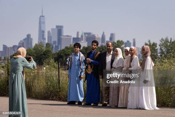 Muslims pose for a photo as they gather to perform the Eid Al-Adha prayer on a field in Brooklyn, NY, United States on July 09, 2022. Eid al-Adha,...