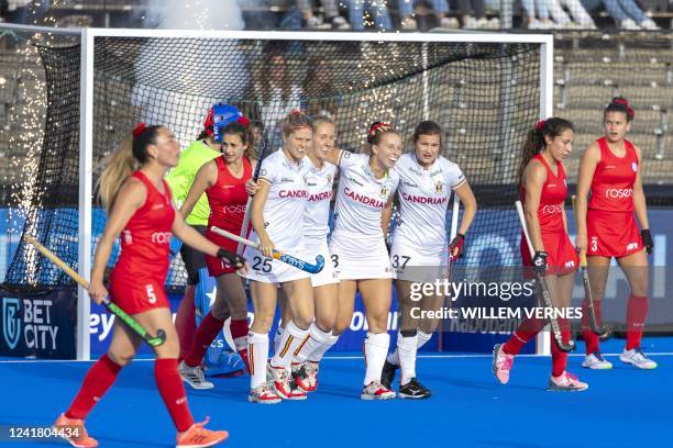 Belgium's Justine Rasir celebrates after scoring during the women's FIH World Cup field hockey match between Belgium and Chile at the Wagener...