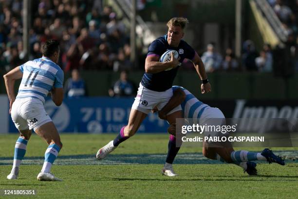 Scotland's Duhan van der Merwe tries to avoid a tackle during the international rugby union test match against Argentina, at the Padre Ernesto...