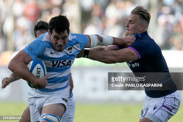 Argentina's Guido Petti runs with the ball past Scotland's Duhan van der Merwe during the international rugby union test match between Argentina and...