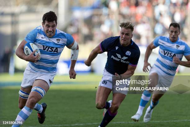 Argentina's Guido Petti runs with the ball past Scotland's Duhan van der Merwe during the international rugby union test match between Argentina and...