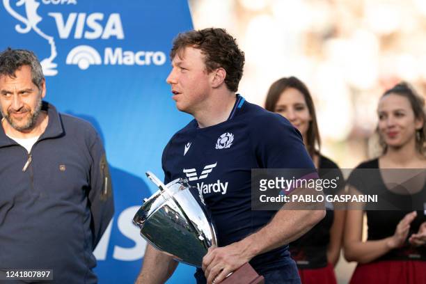 Scotland's Hamish Watson and man of the match receives his trophy at the end of the international rugby union match between Argentina and Scotland at...