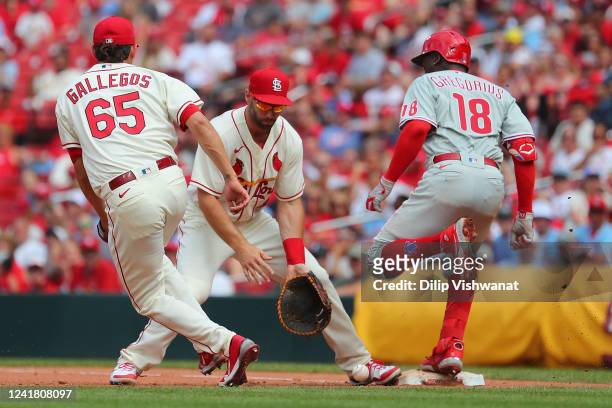 Didi Gregorius of the Philadelphia Phillies reaches first base against Giovanny Gallegos. And Paul Goldschmidt of the St. Louis Cardinals in the...