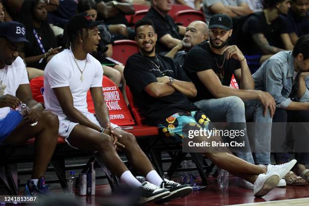 Devonte' Graham, C.J. McCollum and Larry Nance Jr. #22 of the New Orleans Pelicans takes in the game against the Portland Trail Blazers during the...