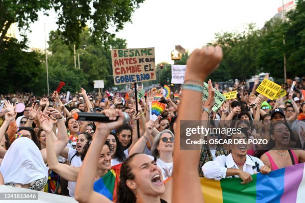 Participants celebrate during the "Marcha del Orgullo" Pride parade in Madrid, on July 9, 2022. - MADO is a series of street celebrations that take...