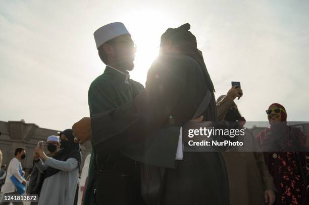Muslims greets after they offer prayers at the Federal Territory mosque on the occasion of Eid al-Adha, in Kuala Lumpur, July 10, 2022.