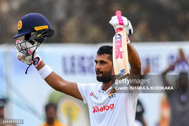 Sri Lanka's Dinesh Chandimal celebrates after scoring a century during the third day of the second cricket Test match between Sri Lanka and Australia...