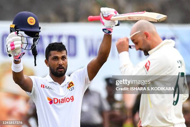 Sri Lanka's Dinesh Chandimal celebrates after scoring a century during the third day of the second cricket Test match between Sri Lanka and Australia...