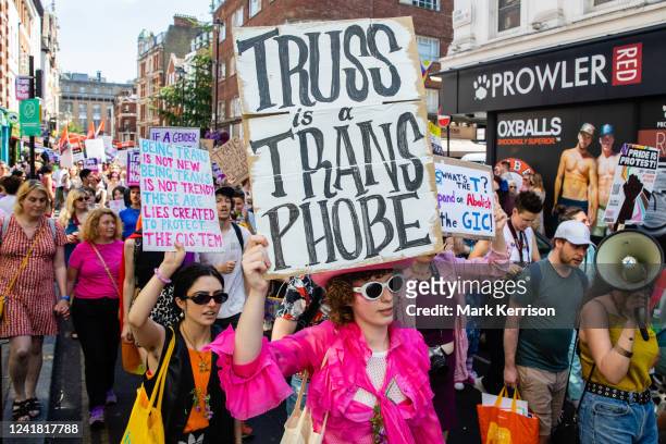 Thousands of people pass through Soho on a London Trans+ Pride march from the Wellington Arch on 9th July 2022 in London, UK. London Trans+ Pride is...