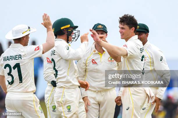 Australia's Mitchell Swepson celebrates with teammates after taking wicket of Sri Lanka's Kamindu Mendis during the third day of second cricket Test...