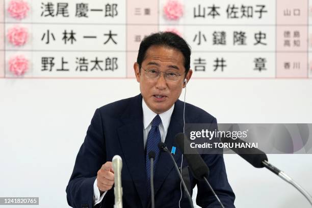 Japan's Prime Minister and the President of the Liberal Democratic Party Fumio Kishida speaks after placing a red paper rose on a LDP candidate's...