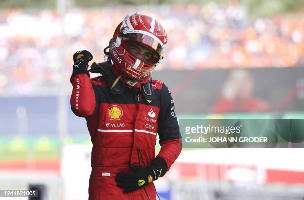 Ferrari's Monegasque driver Charles Leclerc celebrates winning the Formula One Austrian Grand Prix on the Red Bull Ring race track in Spielberg,...