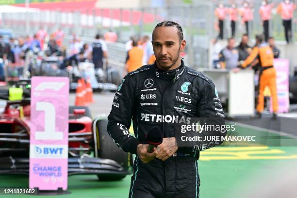 Mercedes' British driver Lewis Hamilton reacts after taking the third place of the Red Bull Ring race track in Spielberg, Austria, during the Formula...