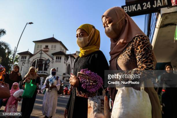 Indonesian Muslims attend the Eid al-Adha prayer on the street, on July 10 in Jakarta, Indonesia. Muslims across the world are preparing to celebrate...