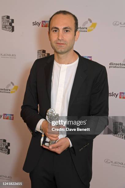 Khalid Abdalla, accepting the Film award on behalf of "Passing", poses in the winners room at the South Bank Sky Arts Awards 2022 at The Savoy Hotel...
