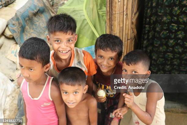 Children pose for a photo in the camp in Cox's Bazar, Bangladesh on July 09, 2022. More than a million Rohingya Muslims, who were displaced due to...