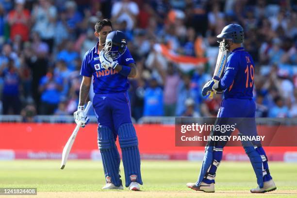 India's Suryakumar Yadav celebrates after reaching his 100 during the '3rd Vitality IT20' Twenty20 International cricket match between England and...