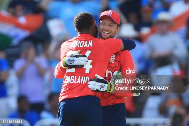England's Chris Jordan and England's Jos Buttler embrace as England celebrate their win in the '3rd Vitality IT20' Twenty20 International cricket...