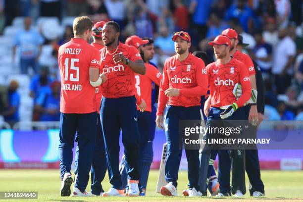 England's players celebrate their win in the '3rd Vitality IT20' Twenty20 International cricket match between England and India at Trent Bridge in...