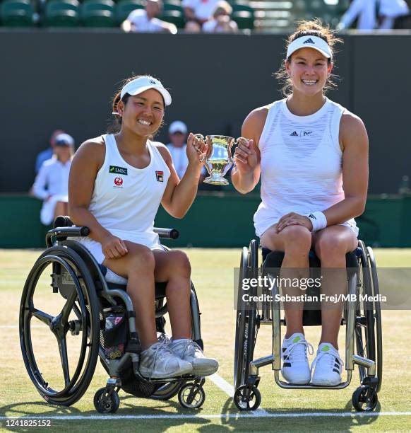 Yui Kamiji of Japan and Dana Mathewson of United States of America holds the trophy after victory against Diede de Groot of Netherlands and Aniek Van...