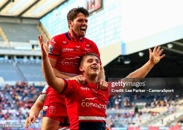 Mikey Lewis of Hull KR is jumped on by Lachlan Coote after he scores a try in the 40th minute to make 14-14 during the Betfred Super League Magic...