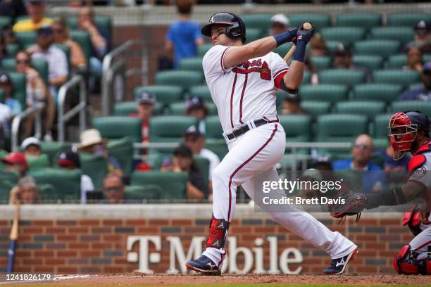 Austin Riley of the Atlanta Braves hits a RBI single against the Washington Nationals in the third inning at Truist Park on July 10, 2022 in Atlanta,...