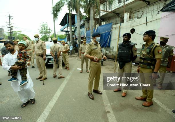 Noida police commissioner Alok Singh and other Police personnel review the security on the occasion of Eid-ul-Adha outside a mosque in Sector 8, on...