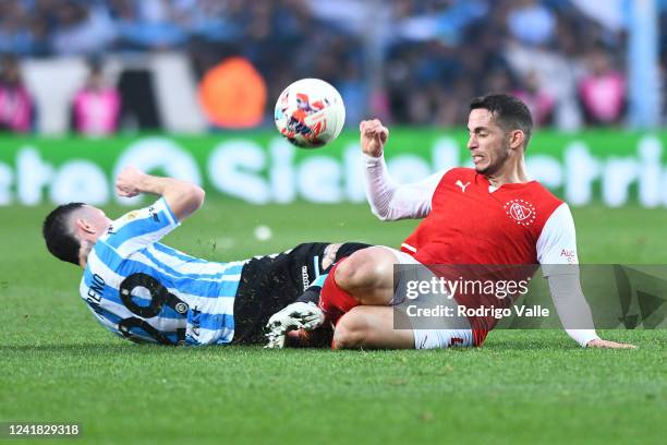 Ivan Marcone of Independiente competes for the ball with Anibal Moreno of Racing Club during a match between Racing Club and Independiente as part of...