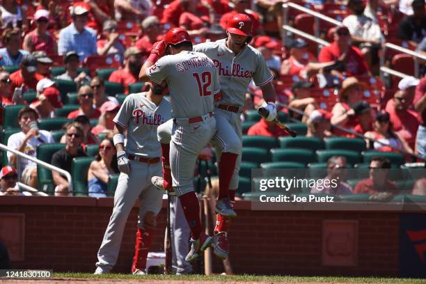 Kyle Schwarber of the Philadelphia Phillies is congratulated by Rhys Hoskins of the Philadelphia Phillies after Schwarber hits a solo home run...