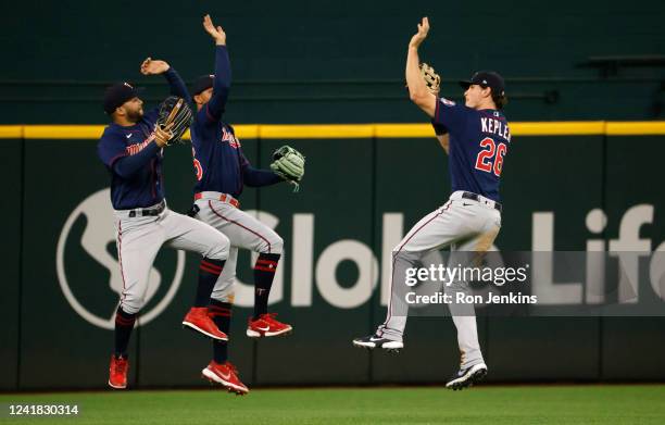 Bill Evers of the Minnesota Twins celebrates with teammates Byron Buxton and Max Kepler after the Twins beat the Texas Rangers 6-5 at Globe Life...