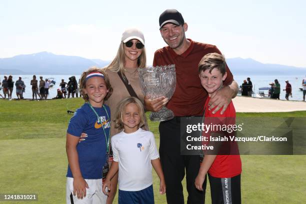 Former NFL quarterback Tony Romo poses with his family after winning the American Century Championship at Edgewood Tahoe Golf Course on July 10, 2022...