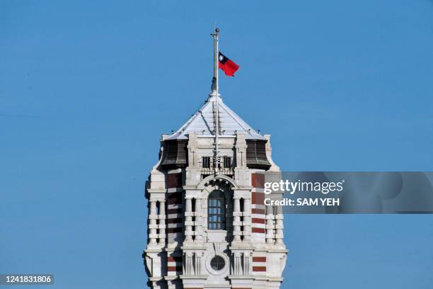 The Taiwanese flag flies at half-mast to pay tribute to former Japanese prime minister Shinzo Abe at the Presidential Palace in Taipei on July 11,...