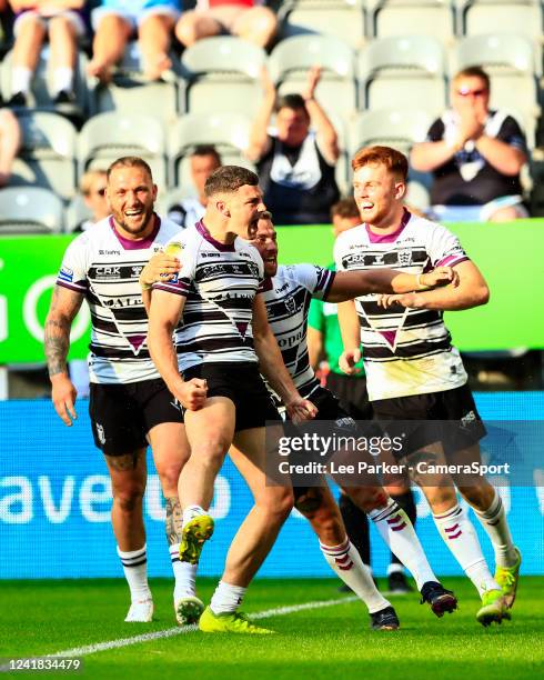 Josh Simm of Hull FC celebrates his try in the 67th minute to make the score 28-30 during the Betfred Super League Magic Weekend match between Hull...