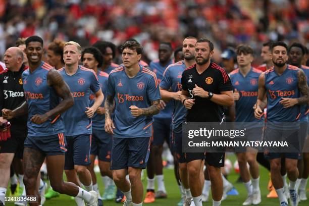 Manchester United players take part in a training session at Rajamangala National Stadium in Bangkok on July 11 a day before an exhibition football...