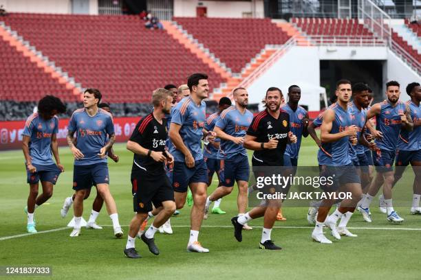 Manchester United players take part in a training session at Rajamangala National Stadium in Bangkok on July 11 a day before an exhibition football...