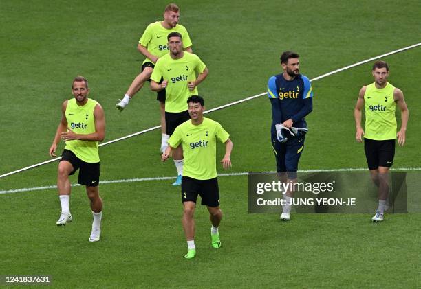 Tottenham Hotspur's South Korean striker Son Heung-min and his teammate Harry Kane attend at an open training session at Seoul World Cup Stadium in...