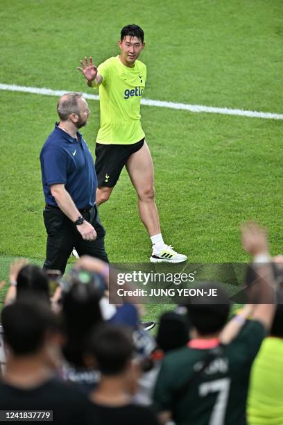 Tottenham Hotspur's South Korean striker Son Heung-min waves to fans after an open training session at Seoul World Cup Stadium in Seoul on July 11 on...
